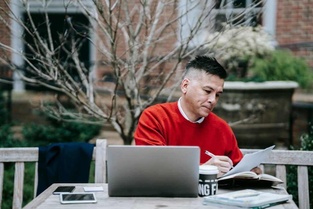 A man reading on paper.