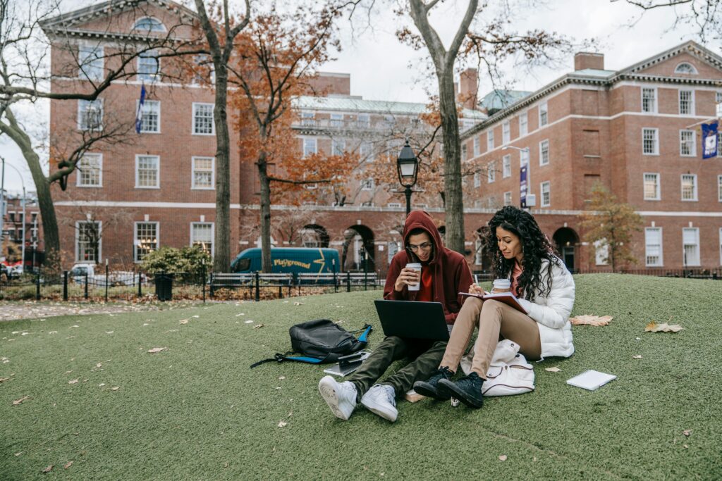 Man and woman studying at a park.