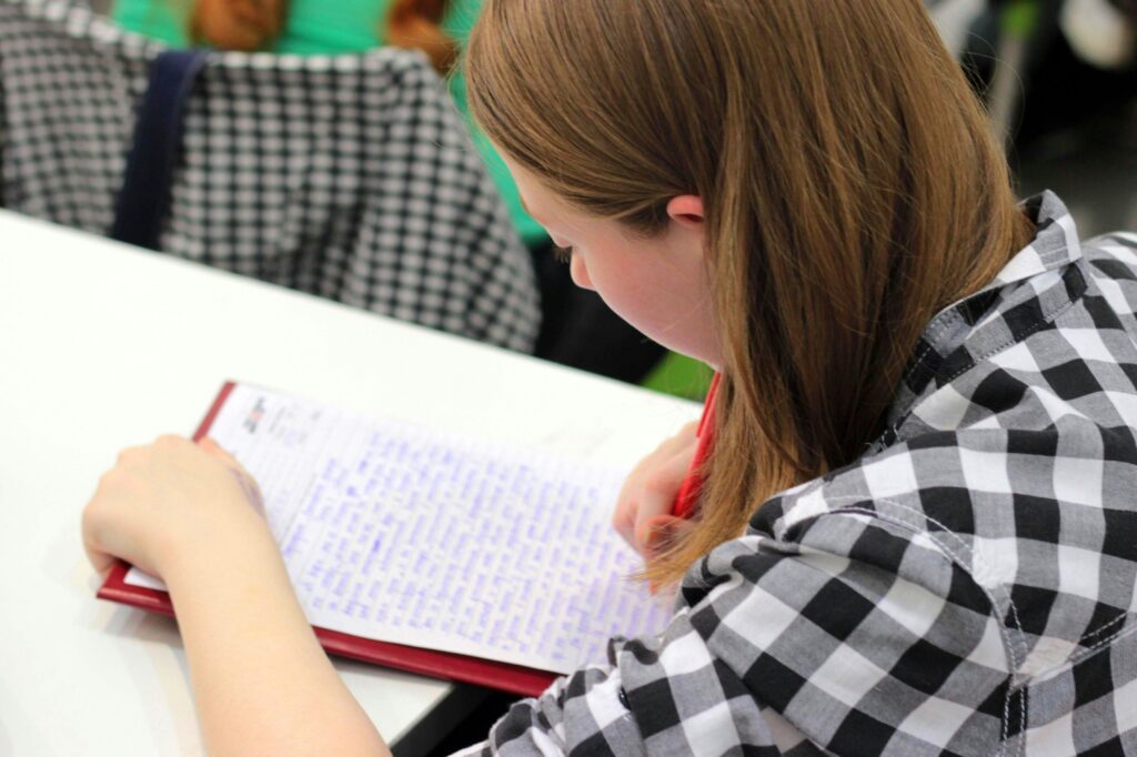 Female student writing on paper